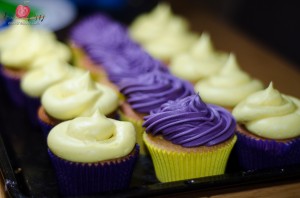 Yellow and purple cupcakes by Tiers of Happiness